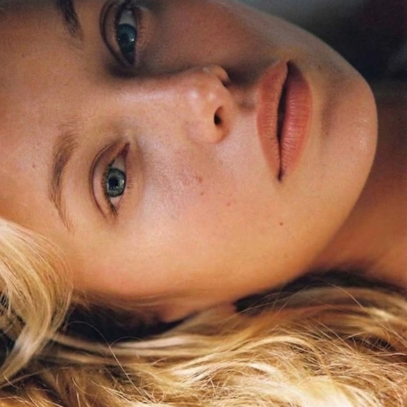 Blond woman lying down