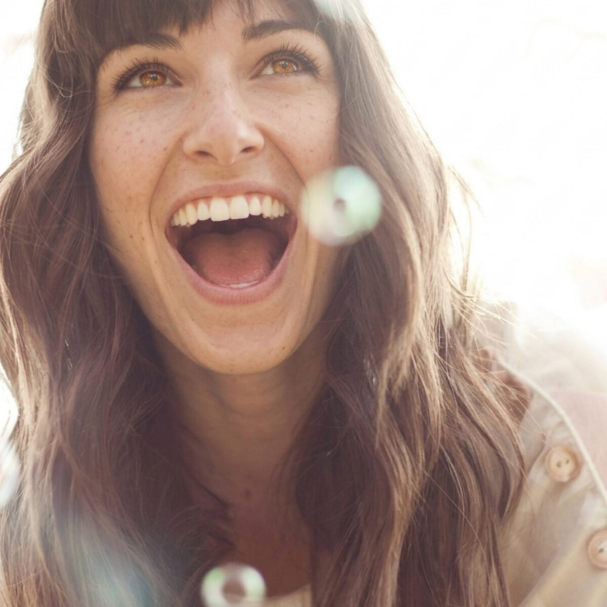 Brown haired woman laughing