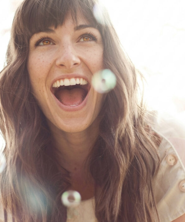 Brown haired woman laughing