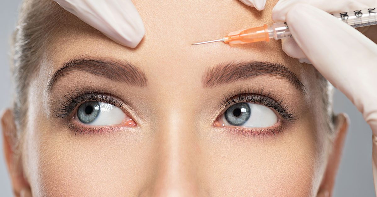 Woman getting Botox in forehead